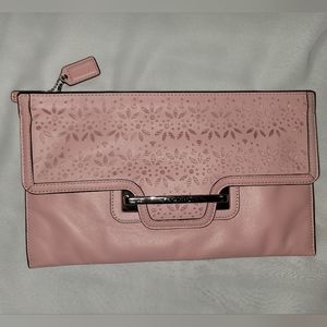 Pink Coach clutch with cut out designs